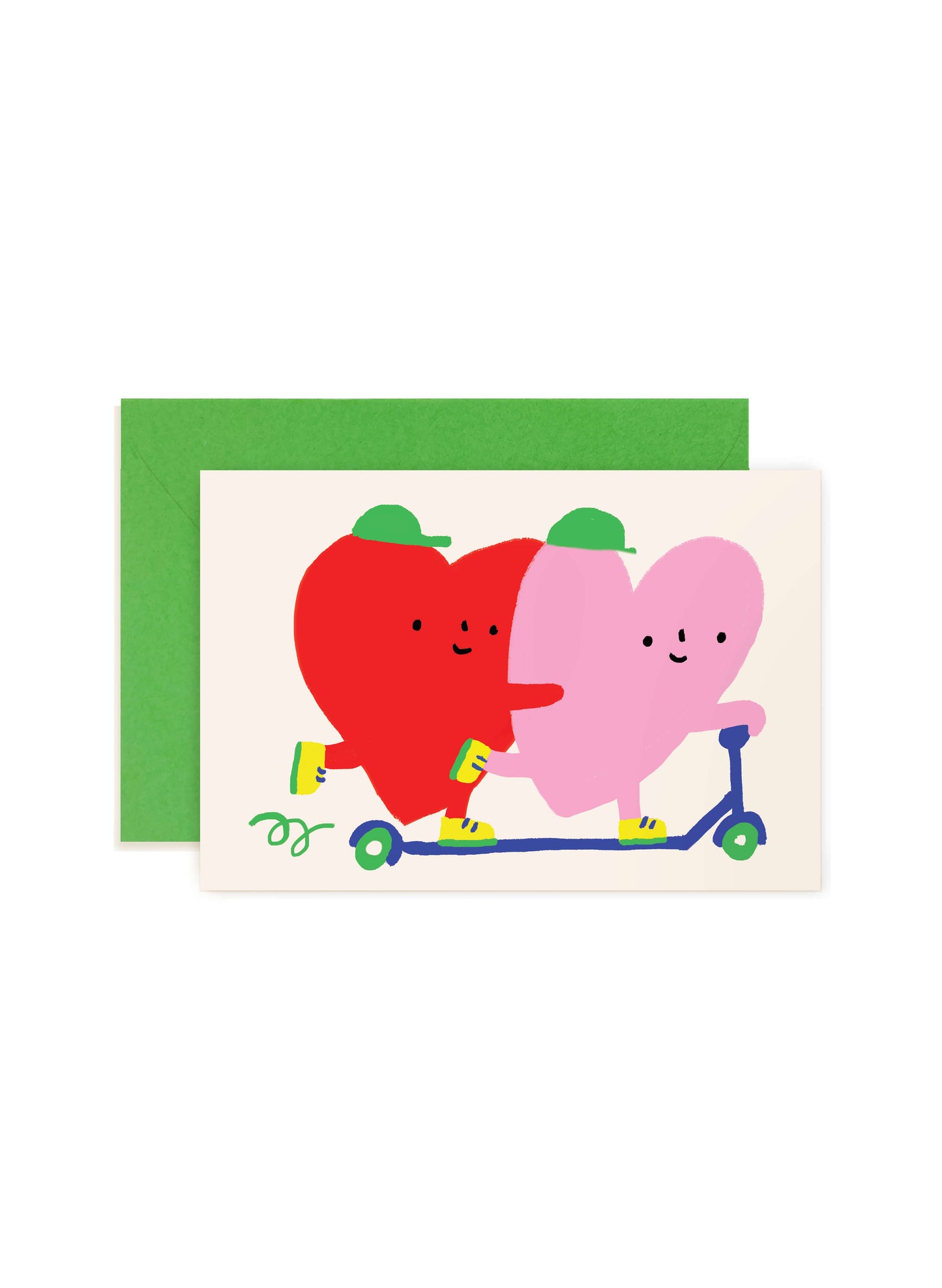 Karen Schipper Scooter Hearts mini note card featuring red and pink hearts riding a blue scooter on a cream background with a green envelope behind it.