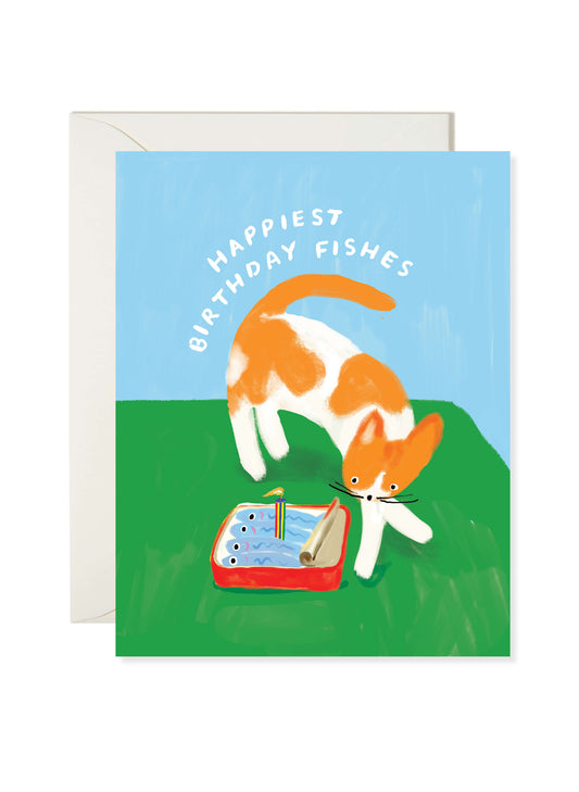 Birthday Fishes Card by Karen Schipper featuring an orange and white cat with a fish birthday cake and playful pun on a blue and green background.
