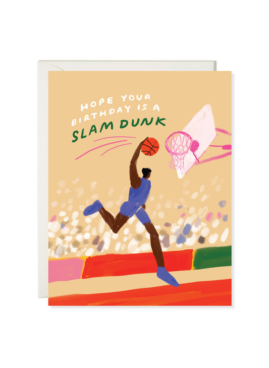 Slam Dunk birthday card by Karen Schipper featuring a basketball player jumping toward a pink hoop with a sports birthday message.
