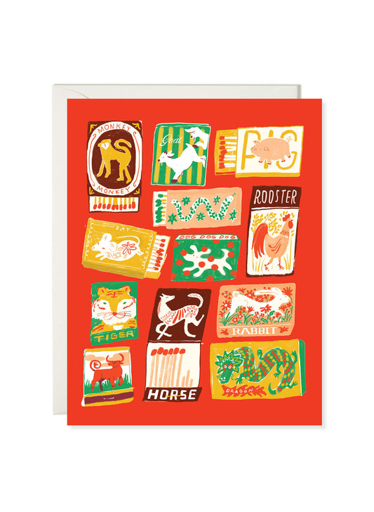 Chinese Zodiac card by Karen Schipper featuring illustrated animal matchbooks on a bold red background.