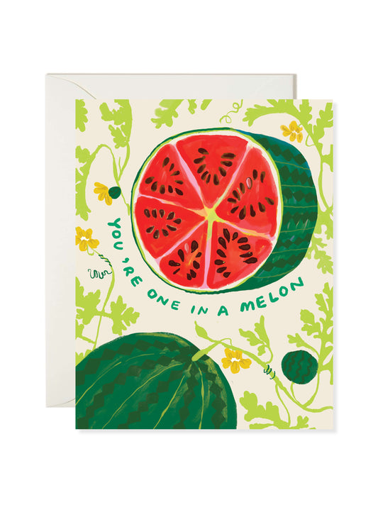 One in a Melon Card by Karen Schipper featuring a red watermelon slice with green rind, surrounded by leafy vines and small yellow flowers, with “You’re one in a melon” text.