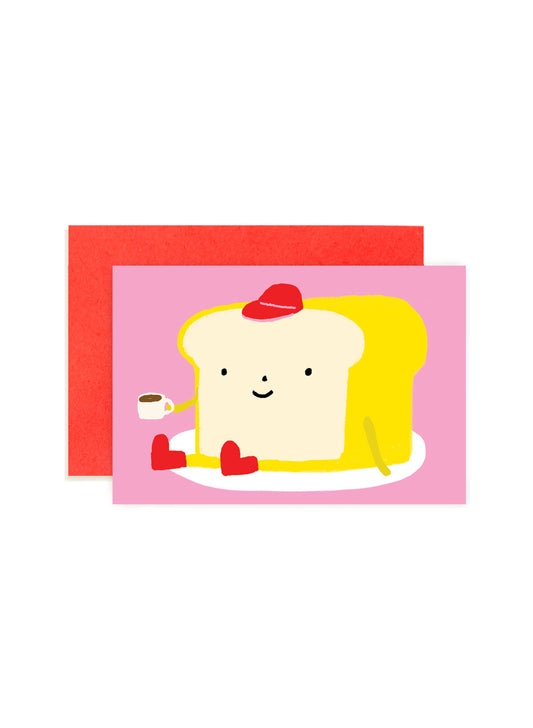 Karen Schipper Bread Loaf mini note card featuring a smiling slice of bread holding a tiny coffee cup on a pink background.
