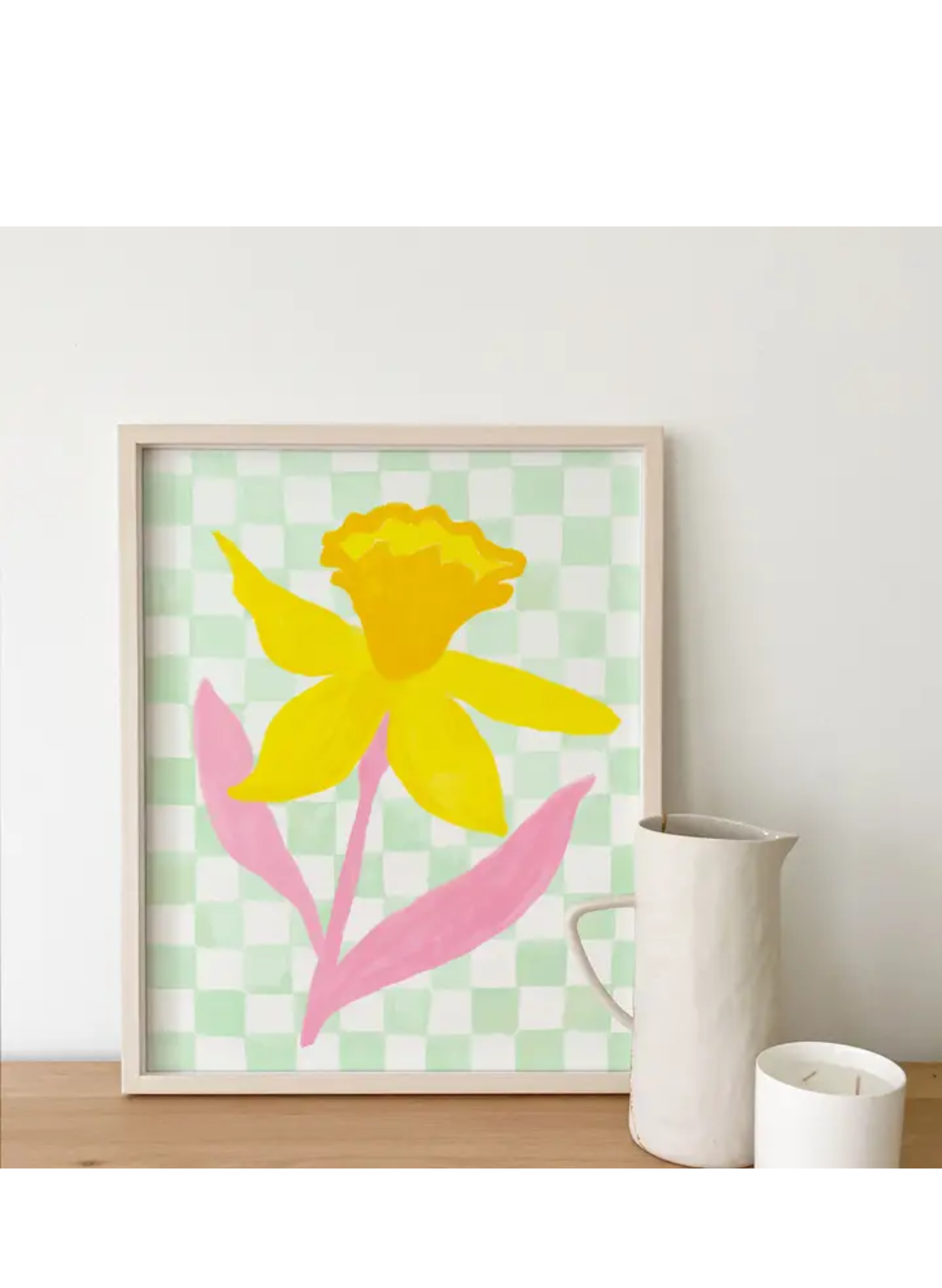 Framed Daffodil Check Art Print by Karen Schipper showing cheerful spring floral wall art with a yellow daffodil and green check pattern.