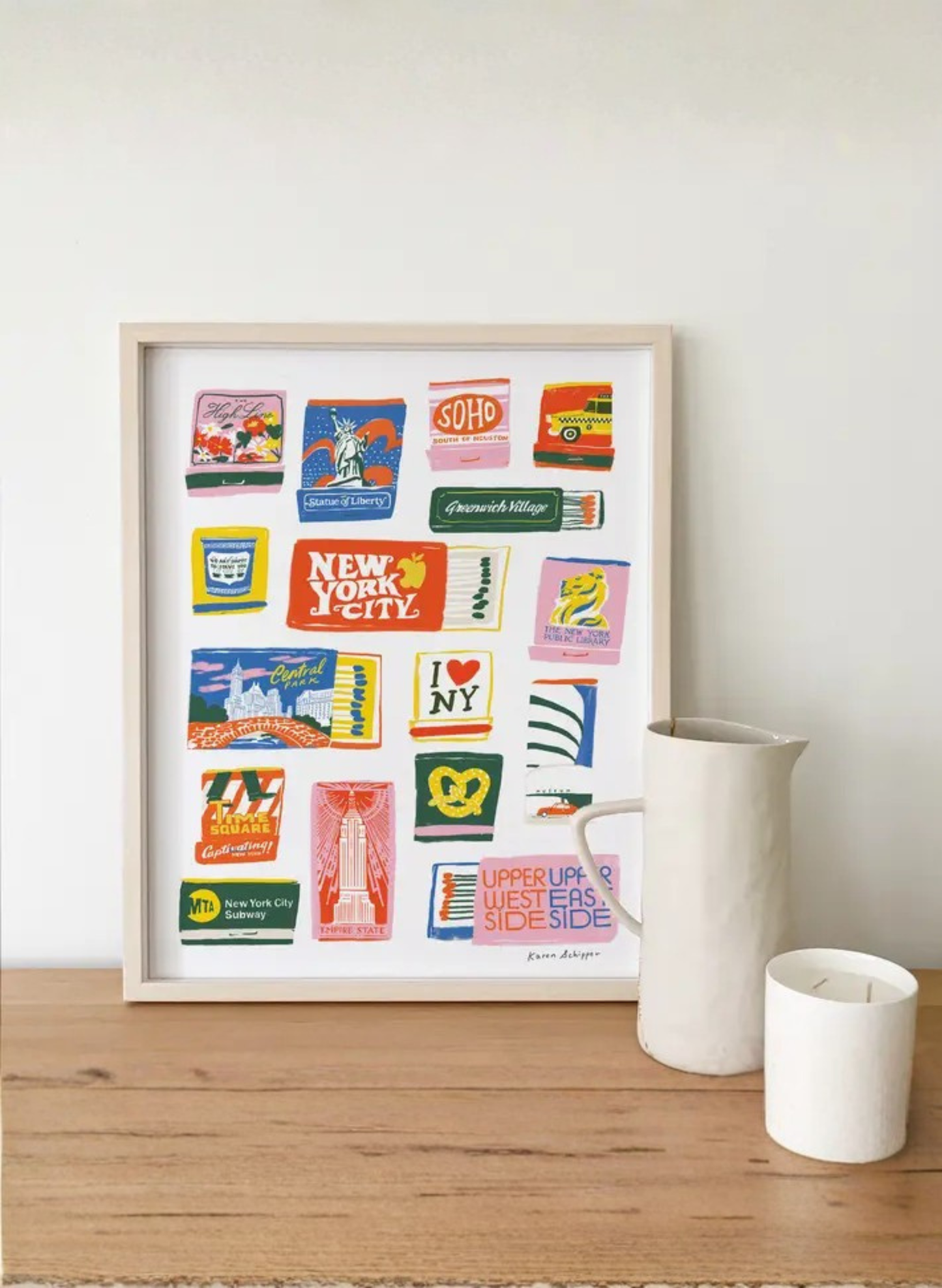 Framed New York City Matchbook Art Print by Karen Schipper styled as colorful NYC wall art with vintage-inspired landmark illustrations.